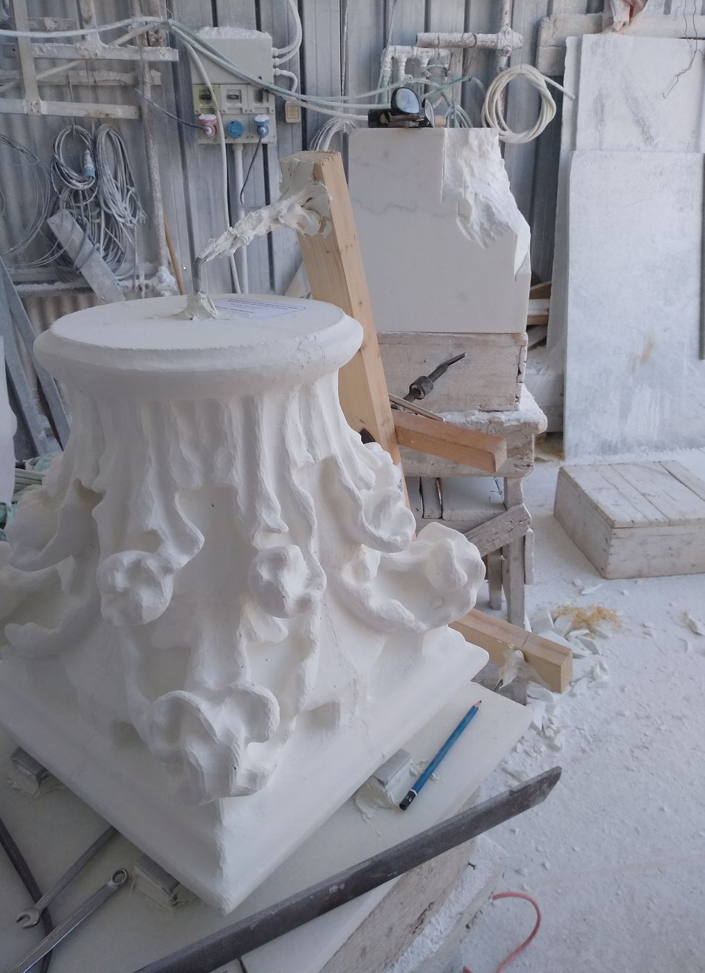 Corinthian marble capital, underside view, in progress at Studio Giannoni's Pietrasanta workshop