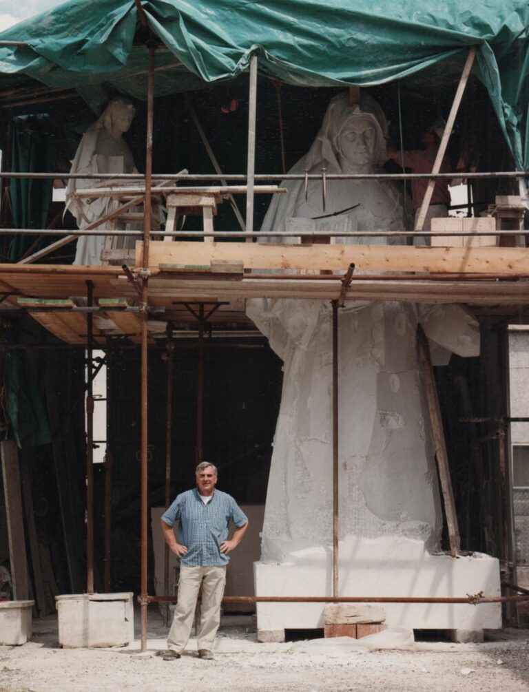 Master sculptor Ulderigo Giannoni using the pointing technique on a marble portrait, Pietrasanta atelier